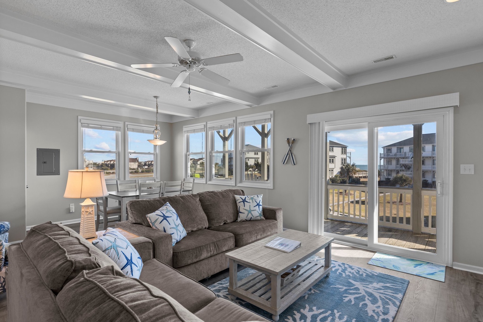 Sink into plush seating while ocean breezes flow through your bright, airy living space with stunning coastal views.
