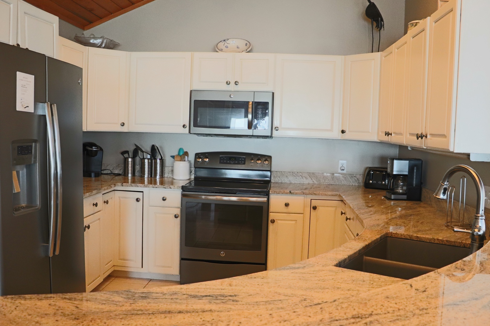 Your fully equipped kitchen awaits with granite counters, stainless appliances, and everything you need to prepare meals during your stay.
