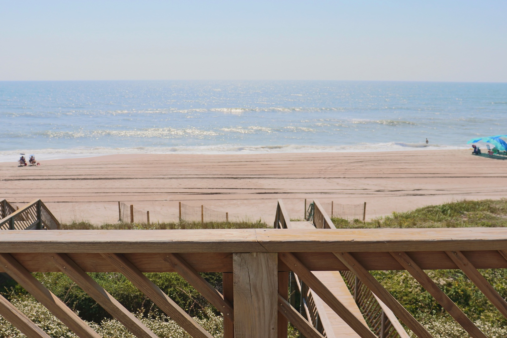 Beachfront location with direct ocean access and pristine sandy shoreline nearby.