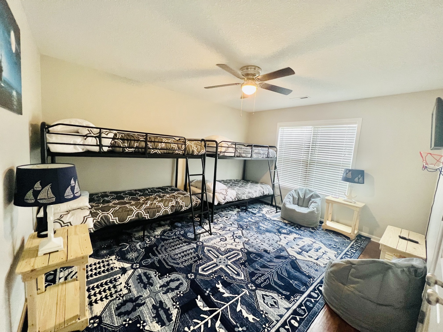 Your kids will love this fun bedroom with sturdy bunk beds, cozy seating, and plenty of space to play and relax together.