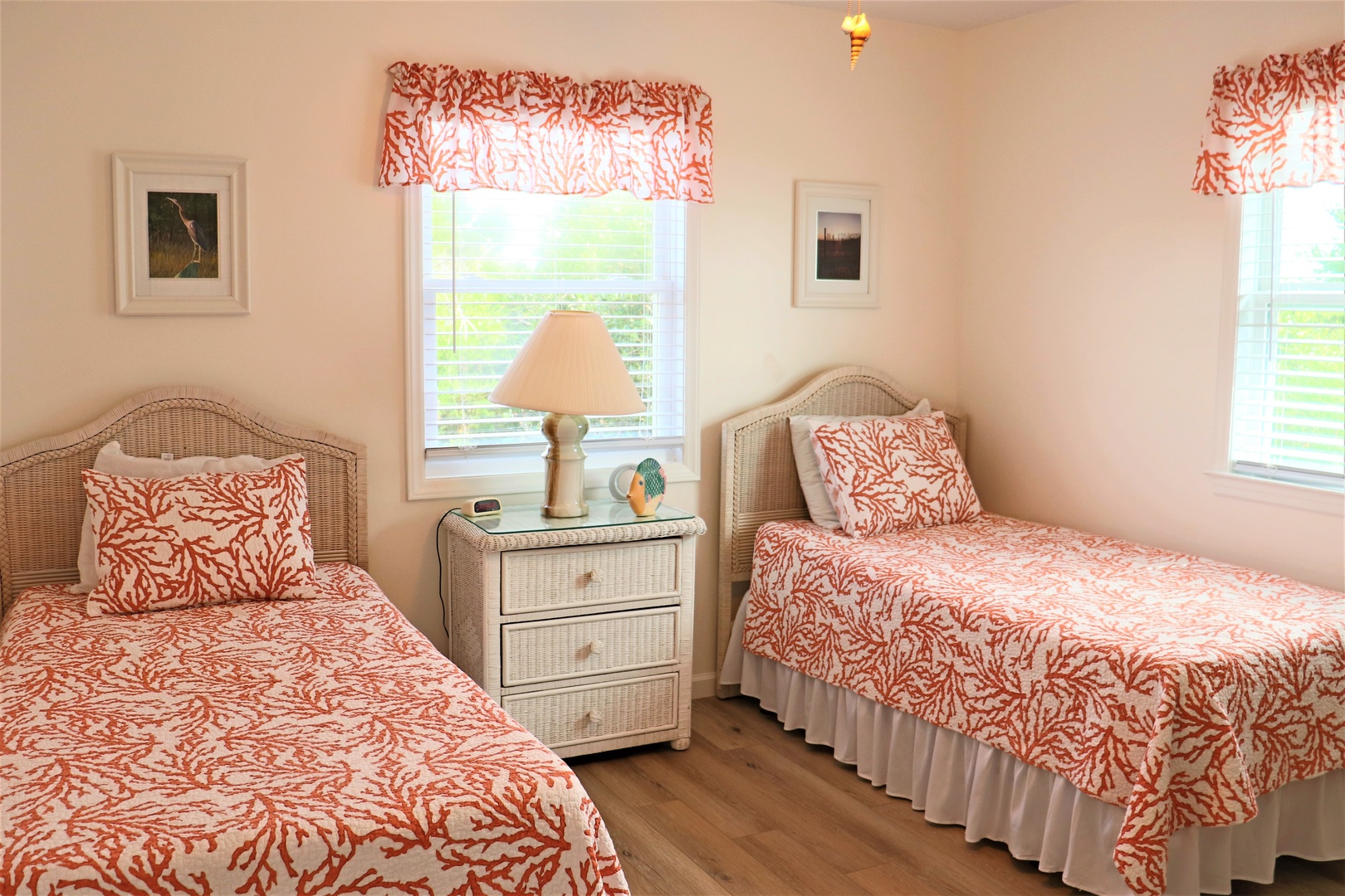 Drift off in your coastal-themed twin bedroom, where coral patterns and wicker touches create seaside serenity.