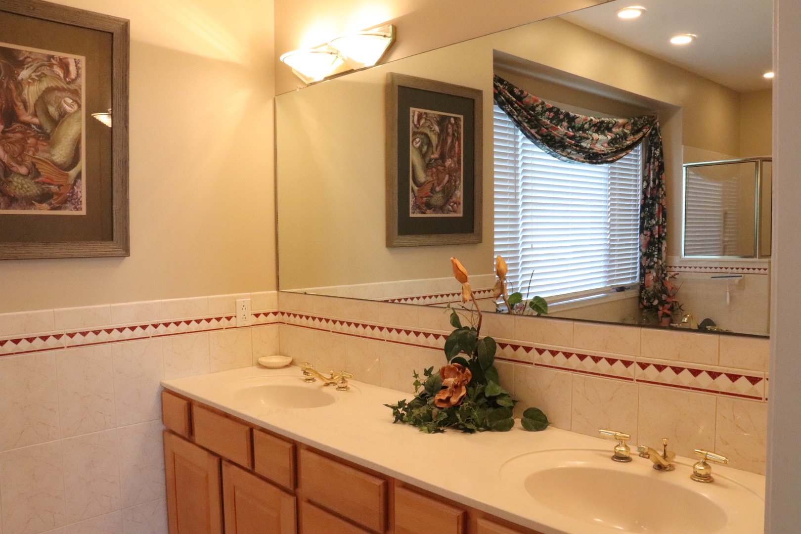 Unwind in your spacious bathroom featuring dual sinks, warm lighting, and elegant touches that make your daily routine feel like a spa experience.