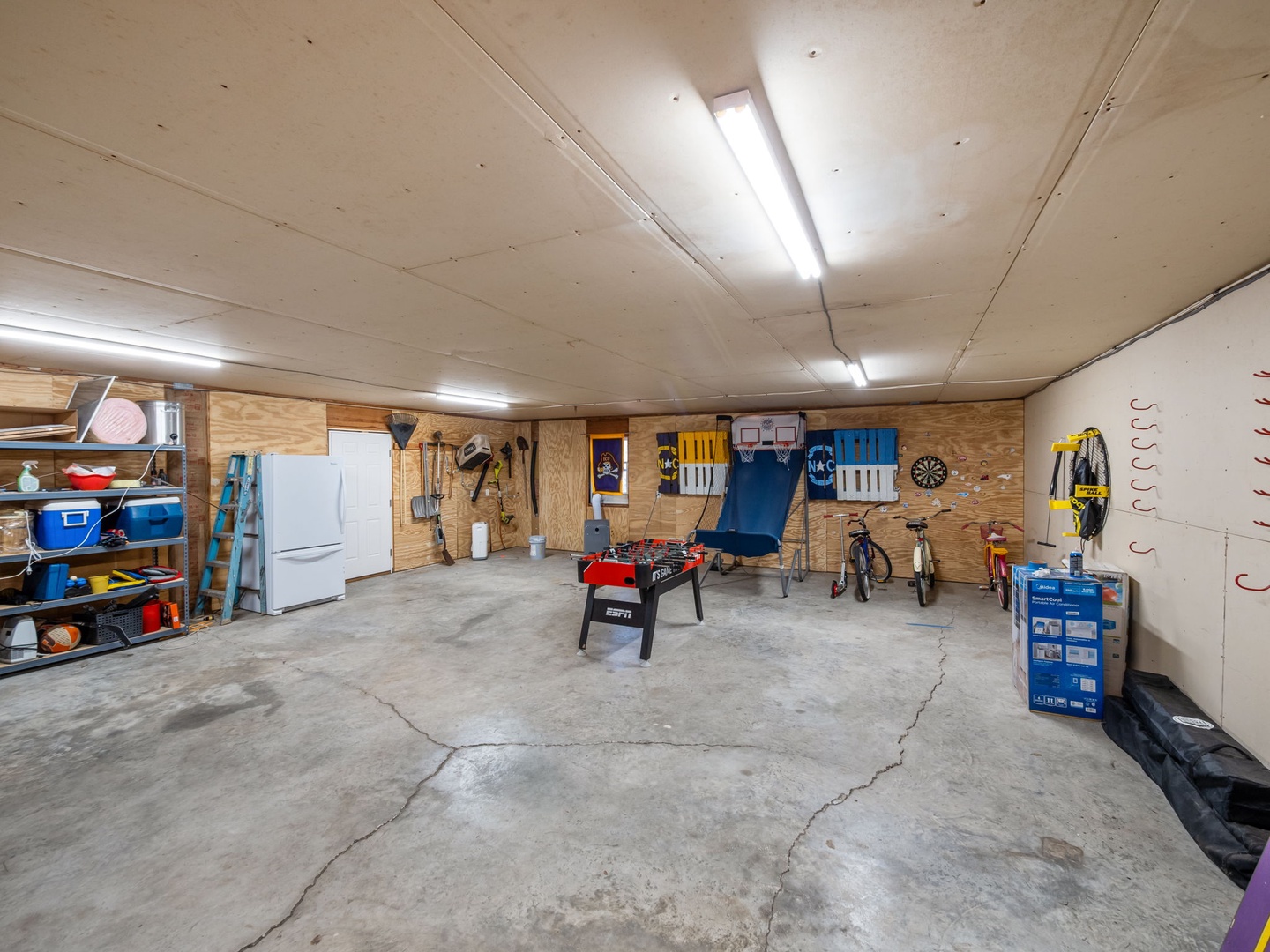 Your own game room awaits with foosball, darts, and entertainment space for endless indoor fun.