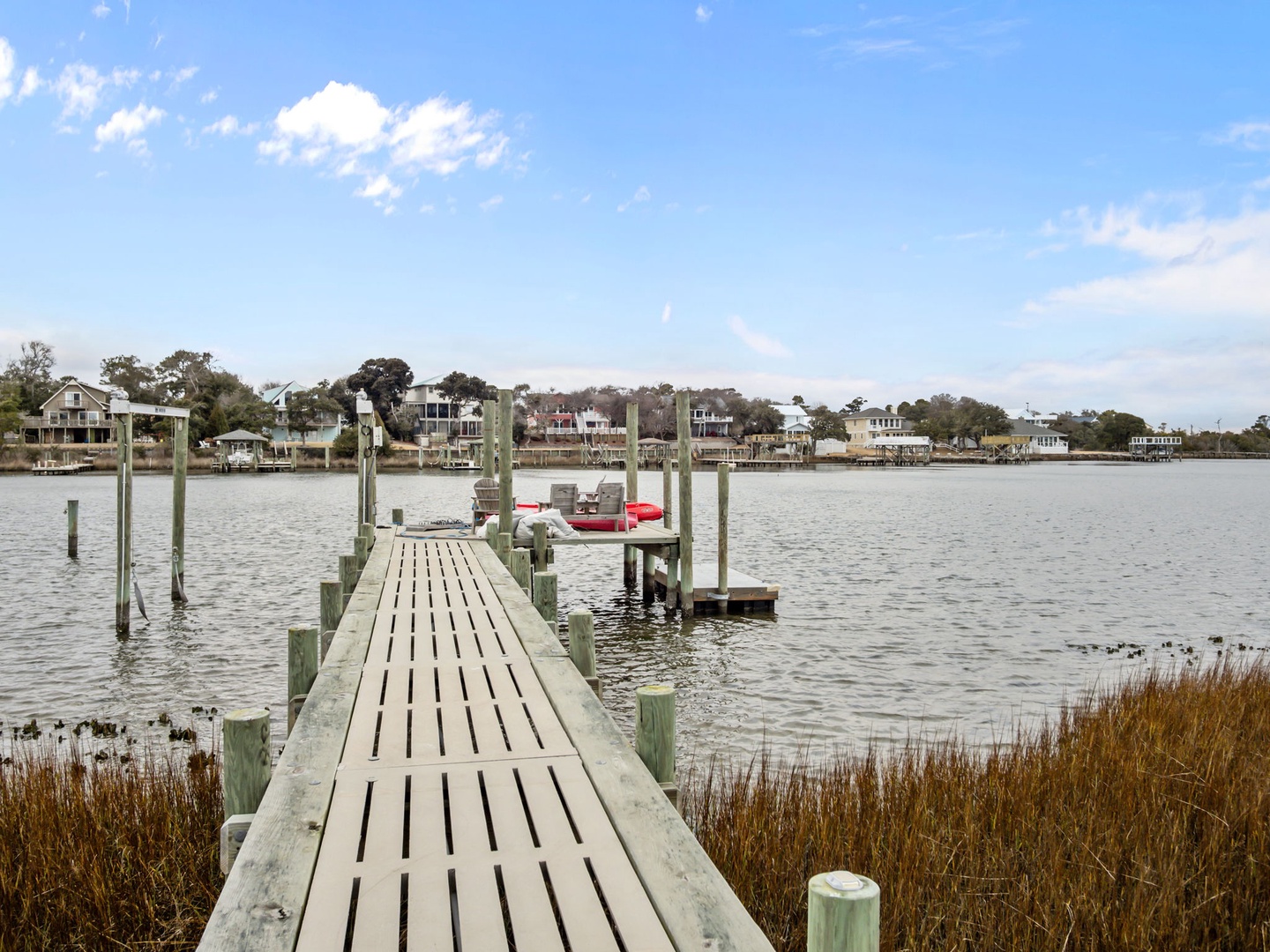 Waterfront community with private dock access overlooking peaceful bay waters and charming coastal homes.