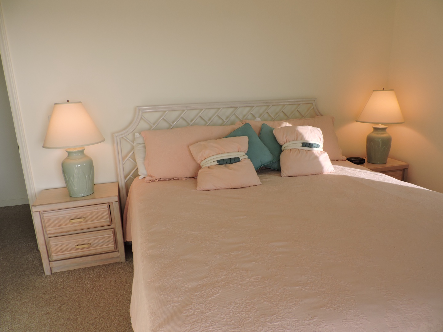 Slip into this serene bedroom where soft lighting and coastal colors create your perfect retreat for restful nights.