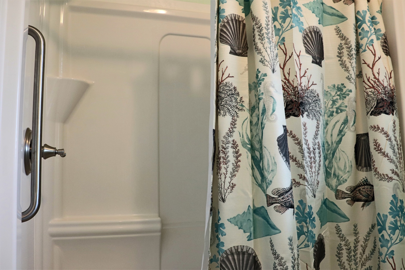 Step into your private shower with ocean-inspired curtains that transport you to the seaside before you even step outside.