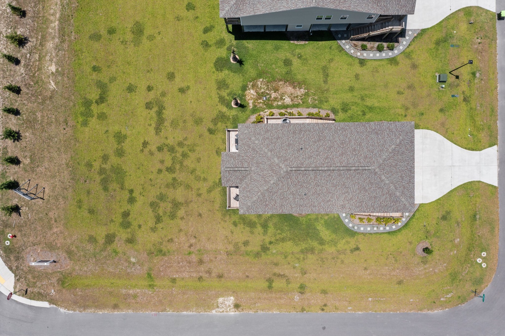 Spacious property with expansive lawns and modern architecture nestled in a quiet residential area.