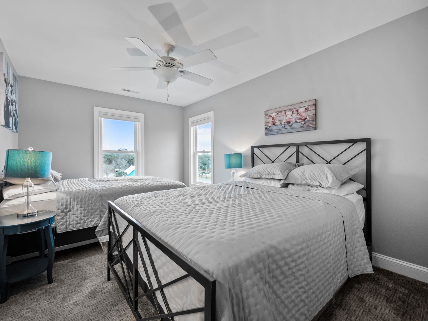 Unwind in your serene bedroom with crisp linens, gentle ceiling fan breezes, and turquoise accents that create the perfect peaceful retreat.