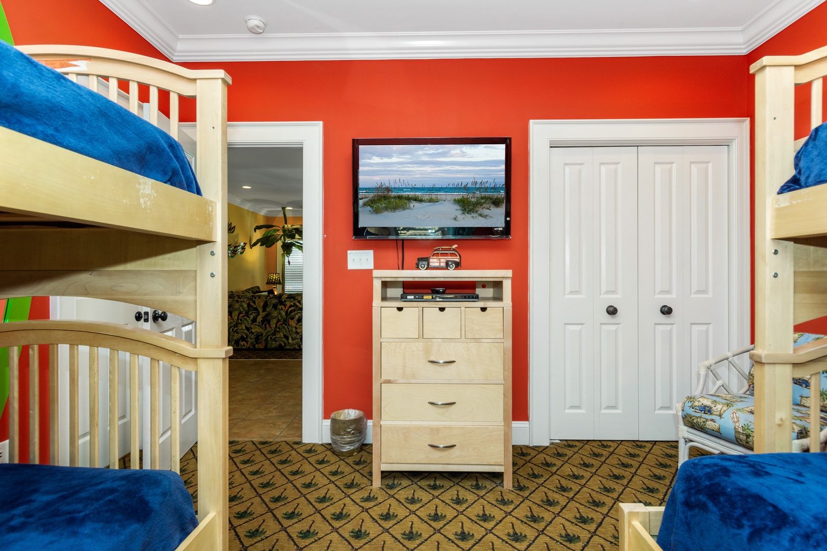 Your kids will love this vibrant room with twin bunk beds, entertainment center, and plenty of storage for family adventures.
