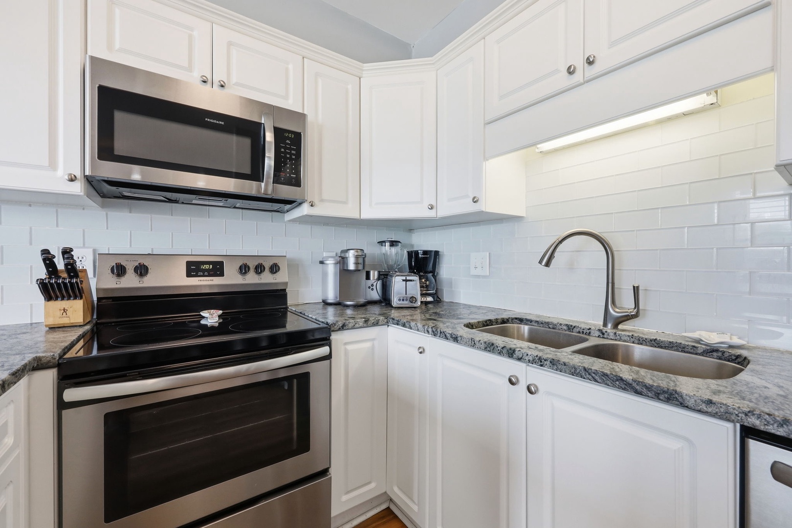 Your fully equipped kitchen features modern appliances and elegant granite counters, ready for you to prepare anything from morning coffee to home-cooked meals during your stay.