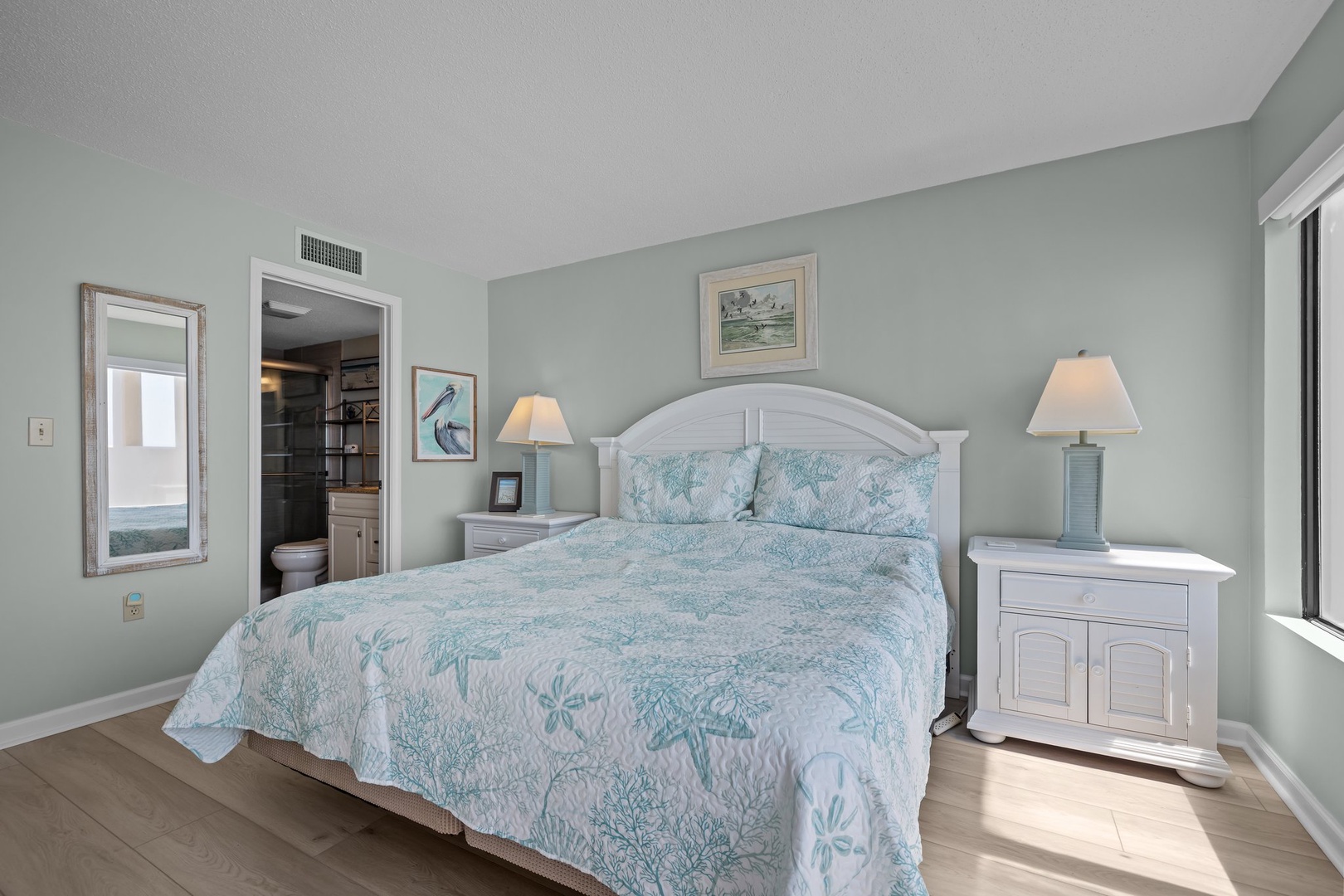 Drift off in this serene coastal bedroom with soft seafoam walls and ocean-inspired linens that make every night feel like a seaside retreat.