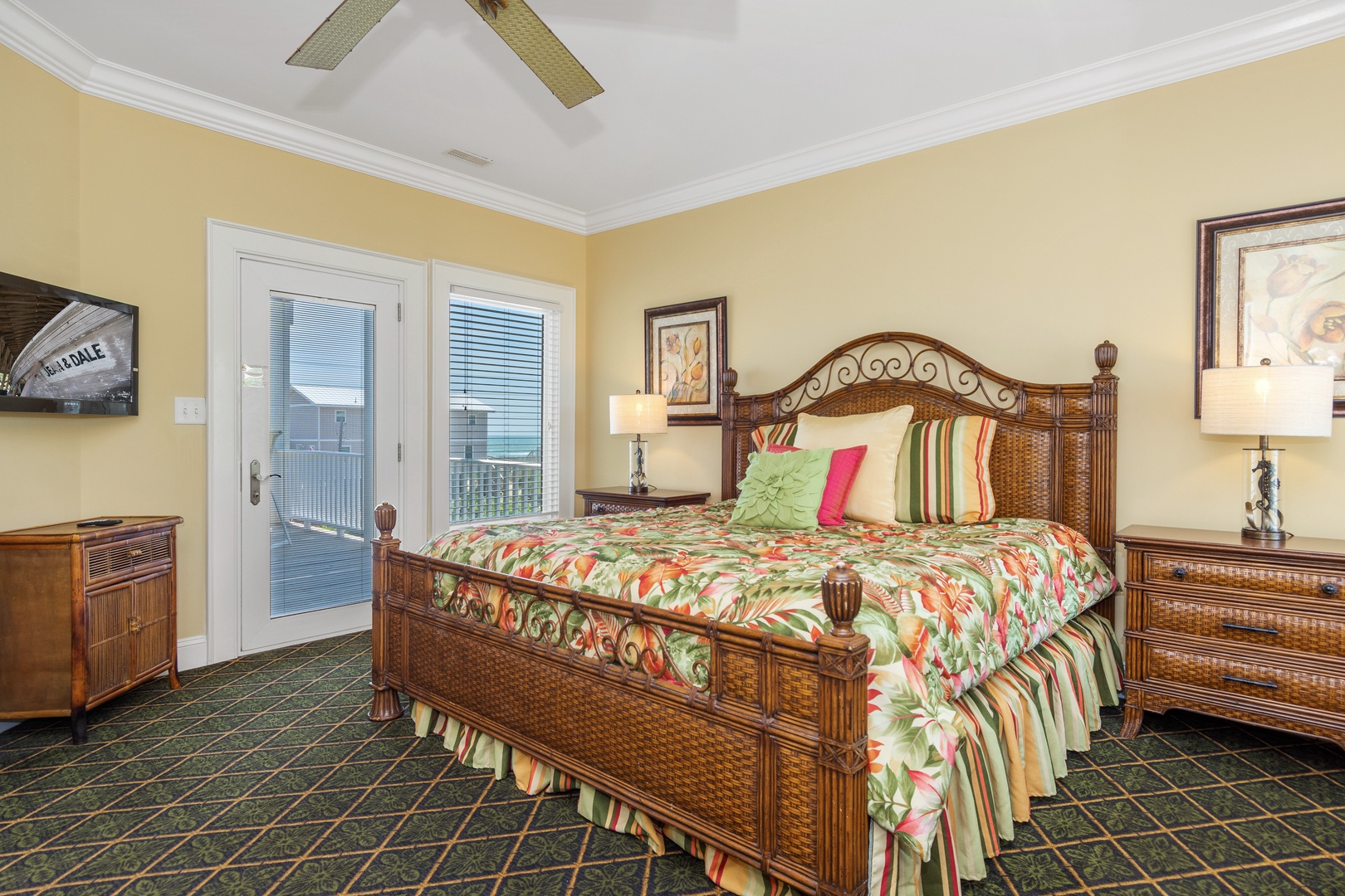 Wake up in your tropical-inspired bedroom featuring handcrafted wicker furnishings and colorful bedding, with French doors opening to your private balcony.