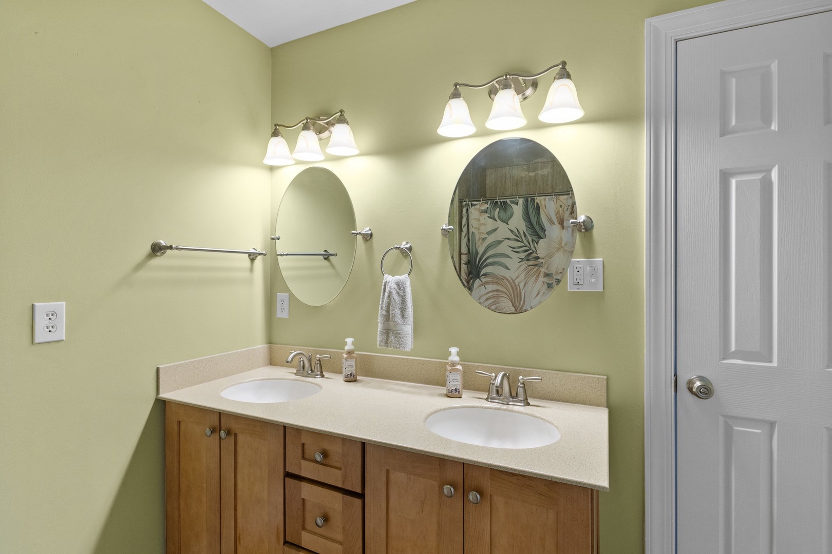 Your dual-sink vanity provides plenty of space for getting ready, with warm lighting and thoughtful touches for your morning routine.