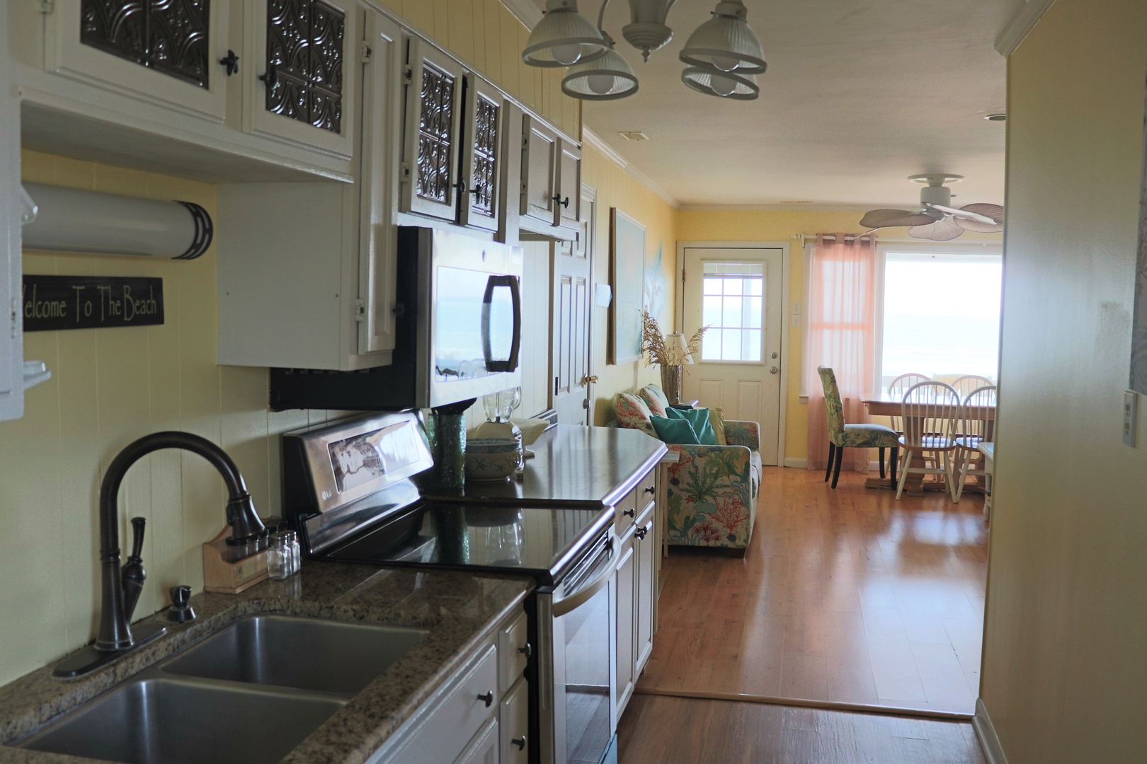 Your fully equipped kitchen flows seamlessly into the bright living space, perfect for cooking meals while staying connected with family and friends.