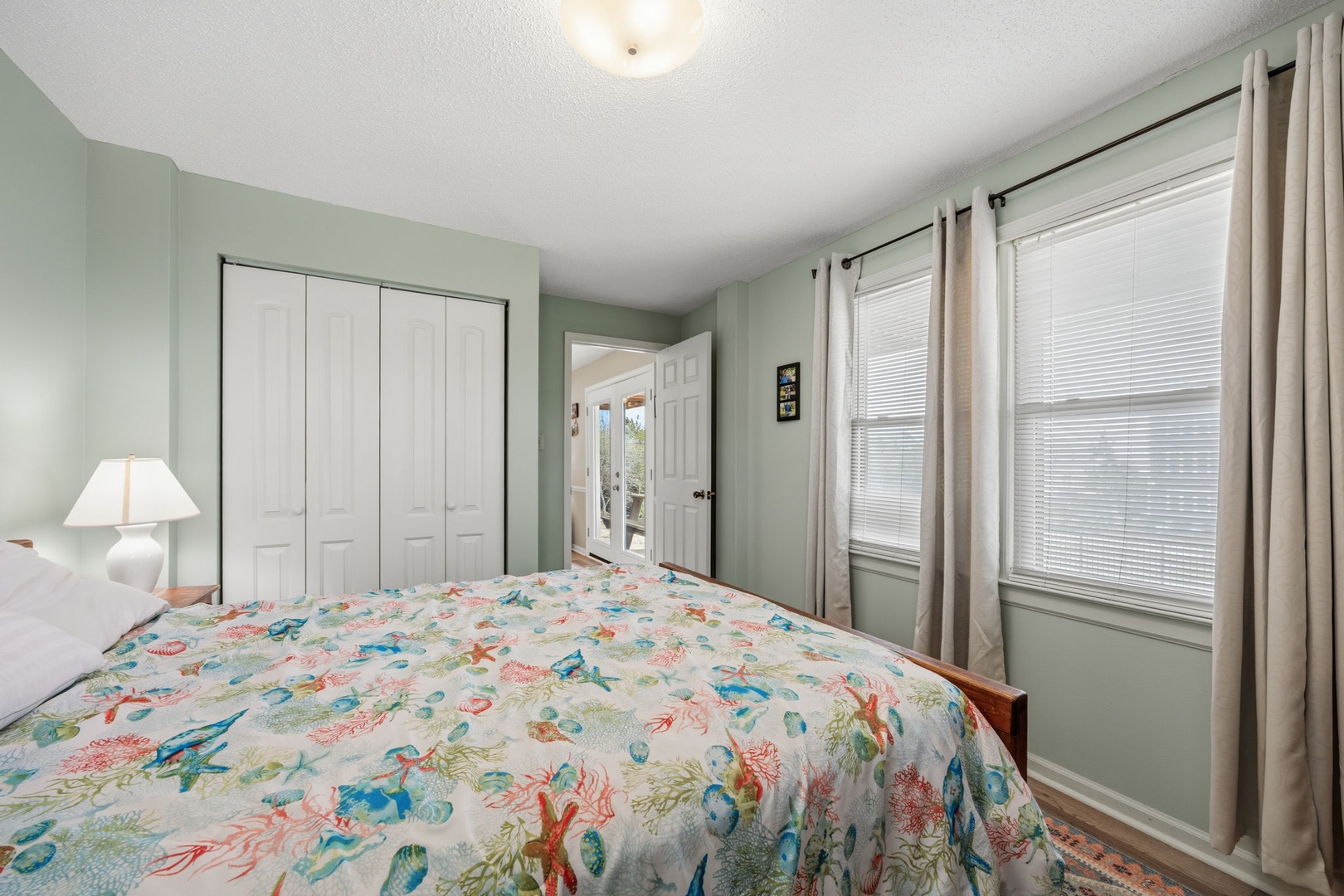 Drift off to sleep surrounded by cheerful coastal colors and ocean-themed bedding in your peaceful retreat.