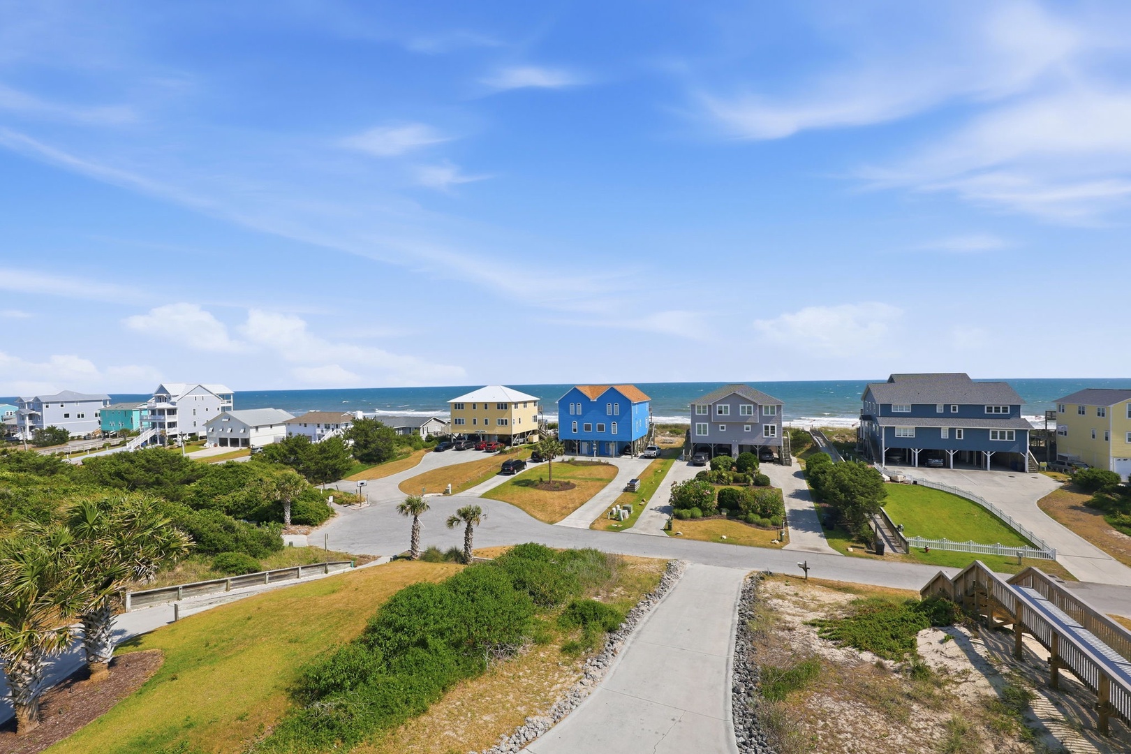 This coastal neighborhood features colorful beachfront homes just steps from the ocean, offering a prime location for your seaside getaway.