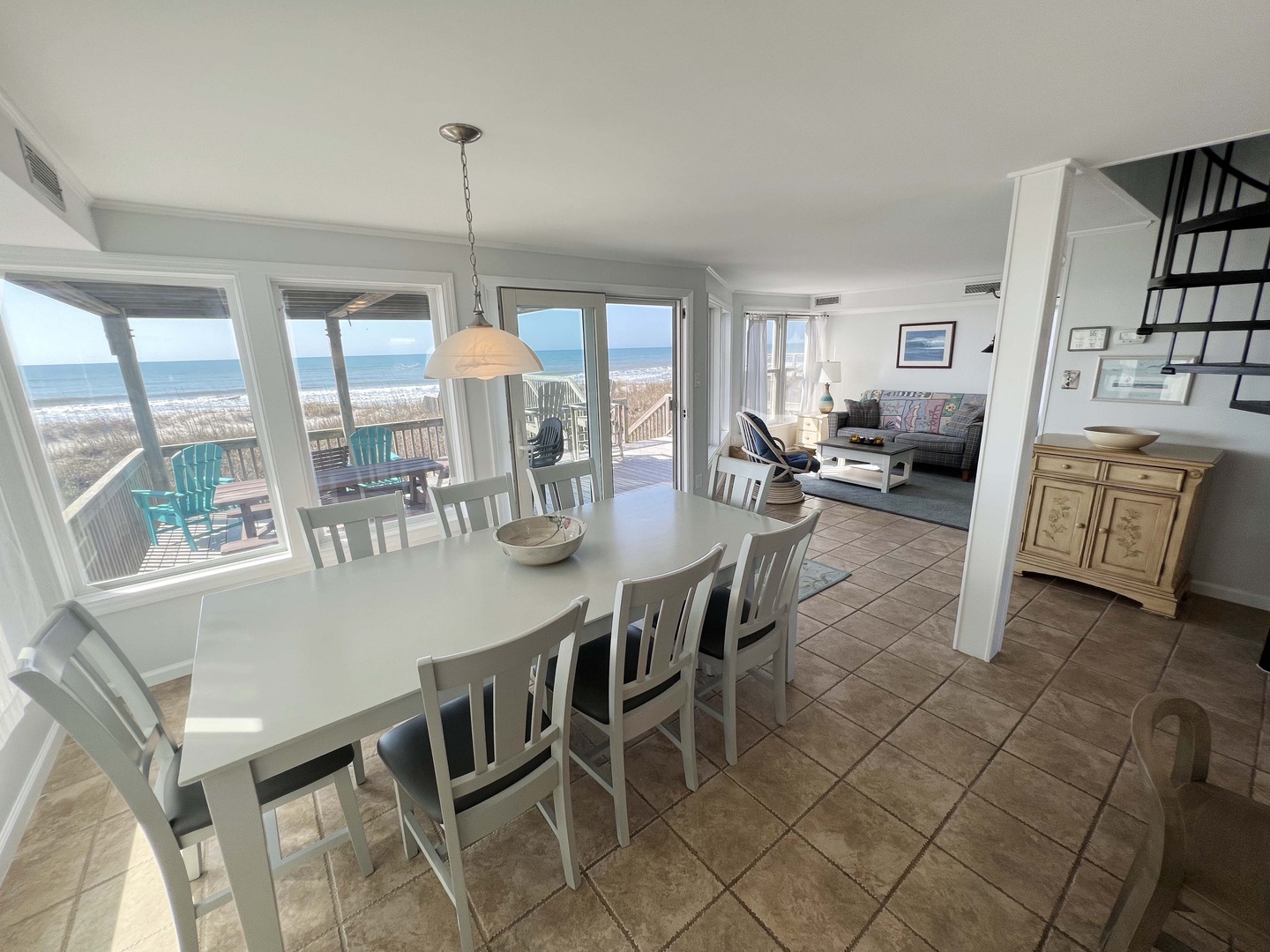 Wake up to stunning ocean views from your spacious dining area, where morning coffee meets endless blue horizons through floor-to-ceiling windows.