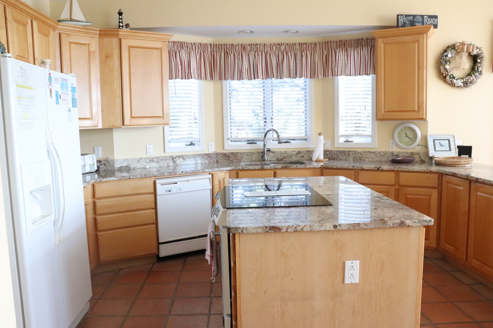 Your fully equipped kitchen features granite countertops, modern appliances, and ample space for preparing memorable meals during your stay.
