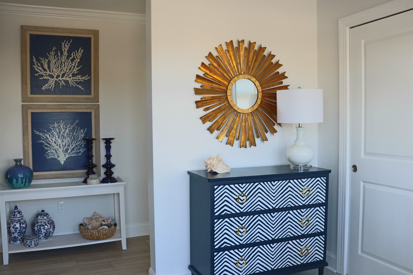 Your stylish retreat features coastal charm with nautical artwork, elegant furnishings, and thoughtful touches that create a serene, sophisticated atmosphere.