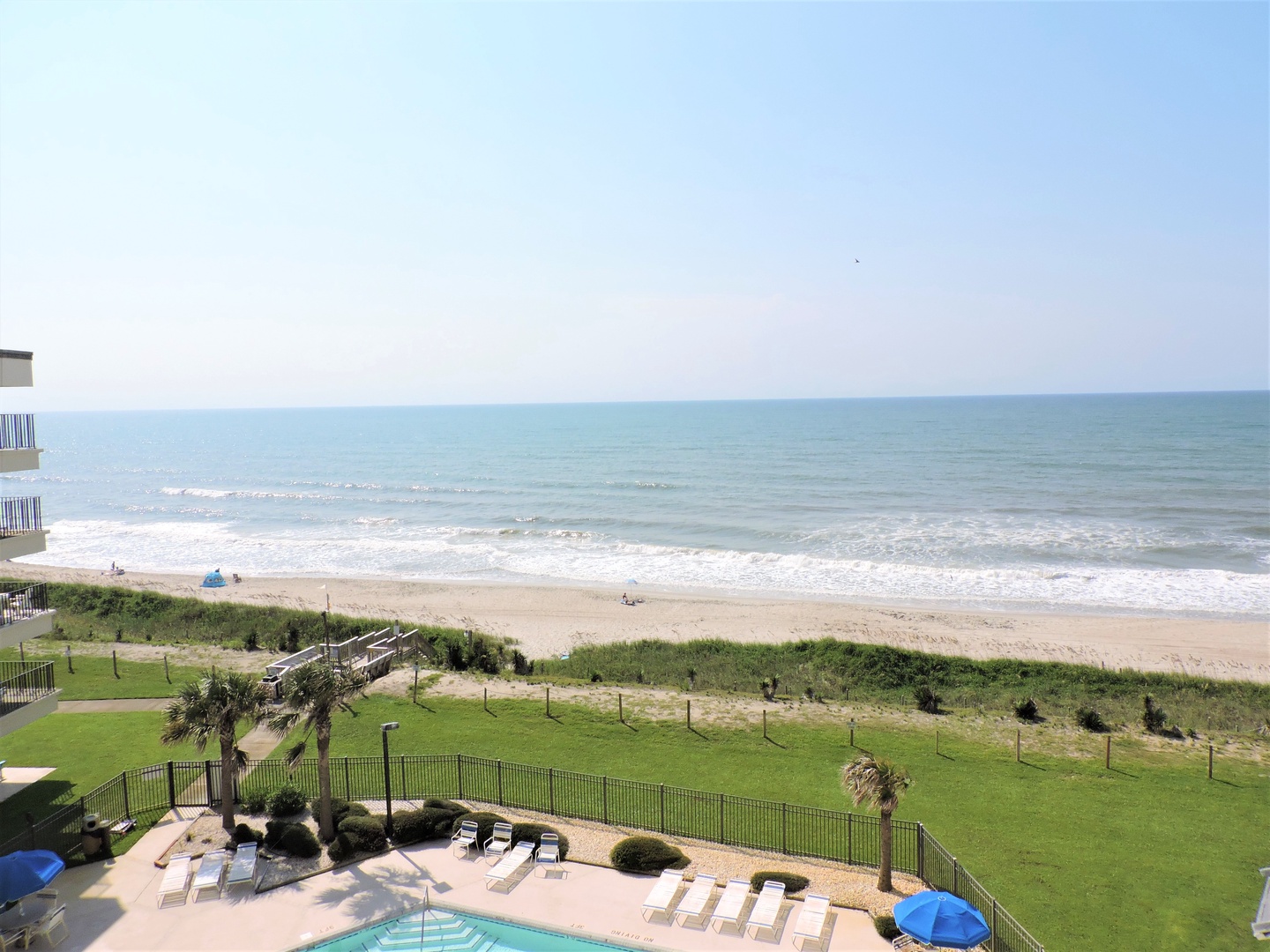 Sweeping oceanfront views showcase pristine beach access just steps from your beachside retreat.