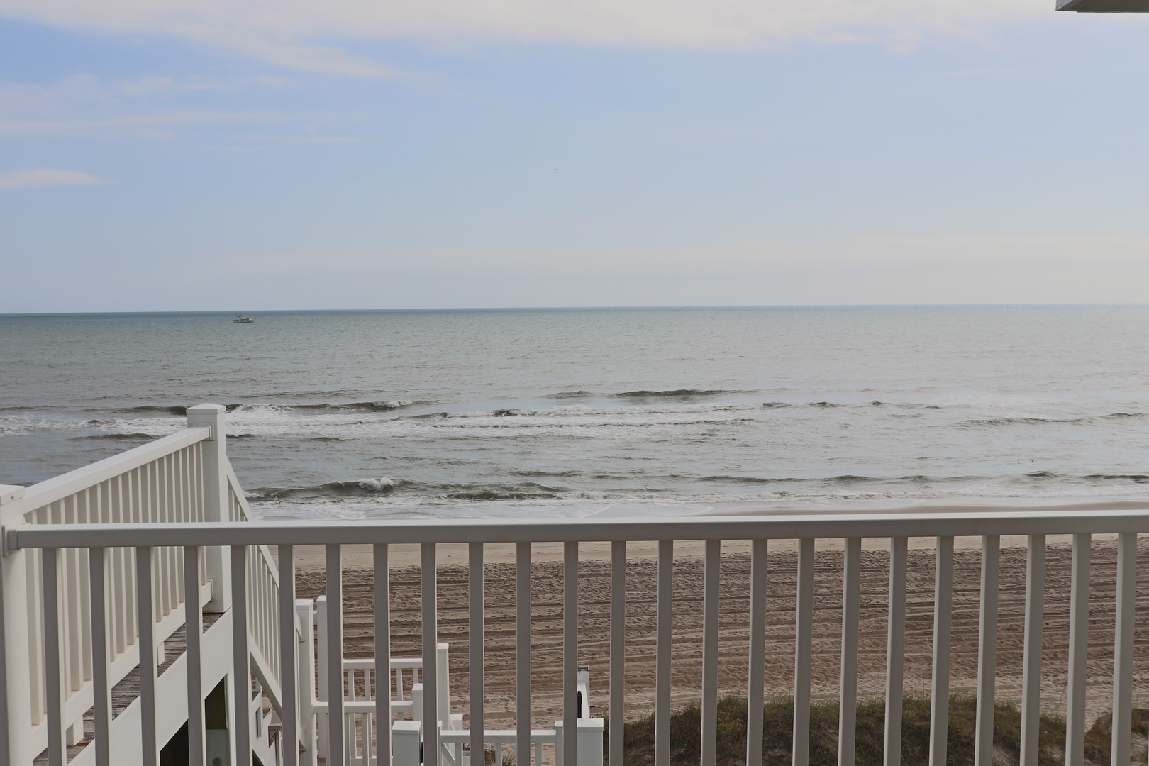Oceanfront balcony with panoramic sea views and direct beach access for your perfect coastal getaway.