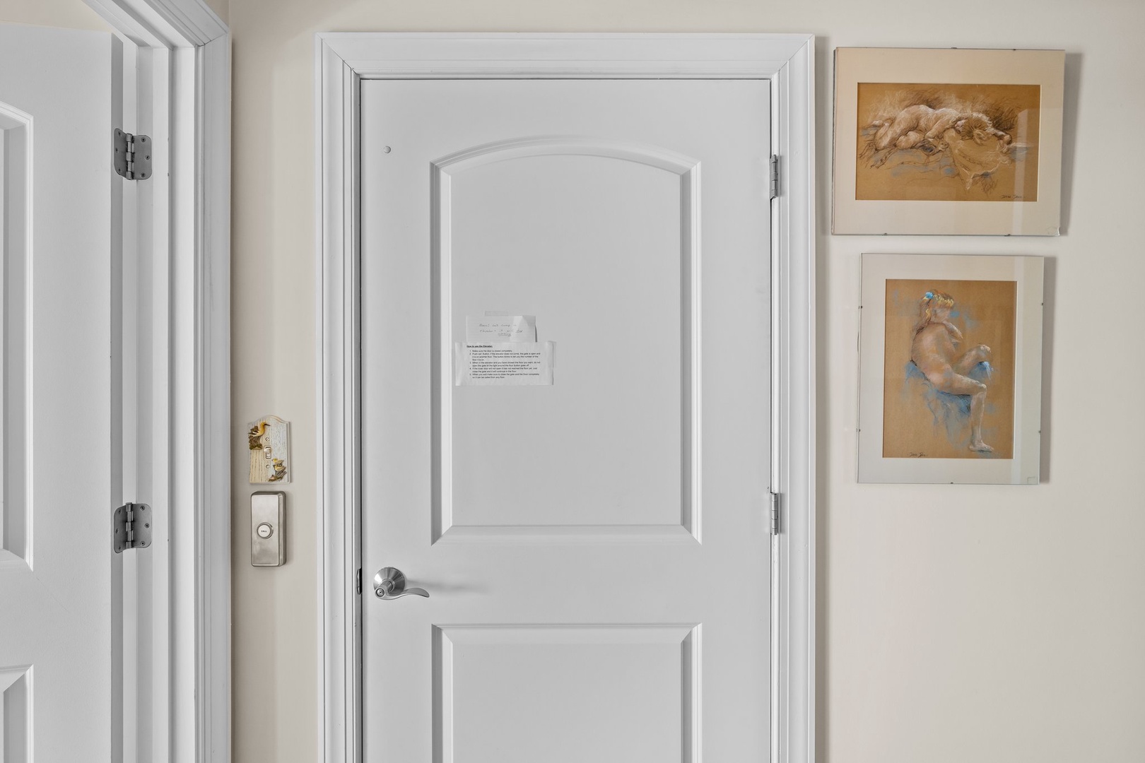 Step into your elegant suite where classic artwork and pristine white doors create a refined, welcoming atmosphere for your stay.