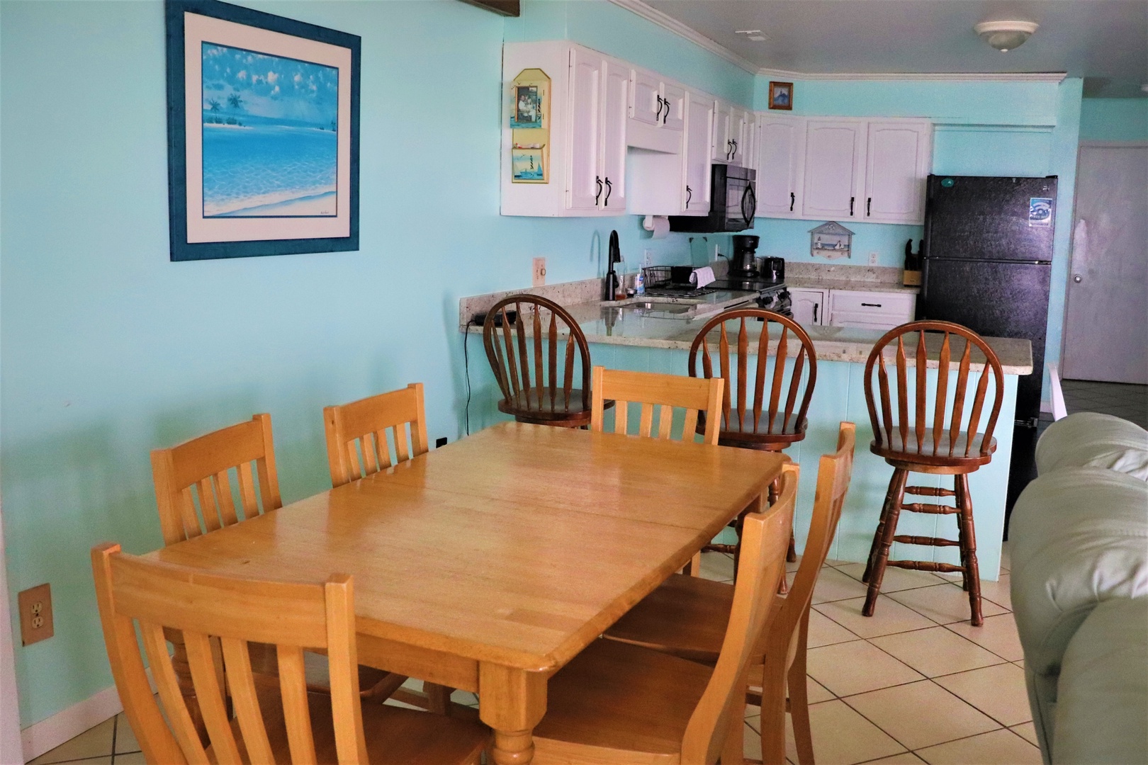 Gather around this spacious dining table for memorable meals with your group, perfectly positioned near your fully-equipped kitchen.