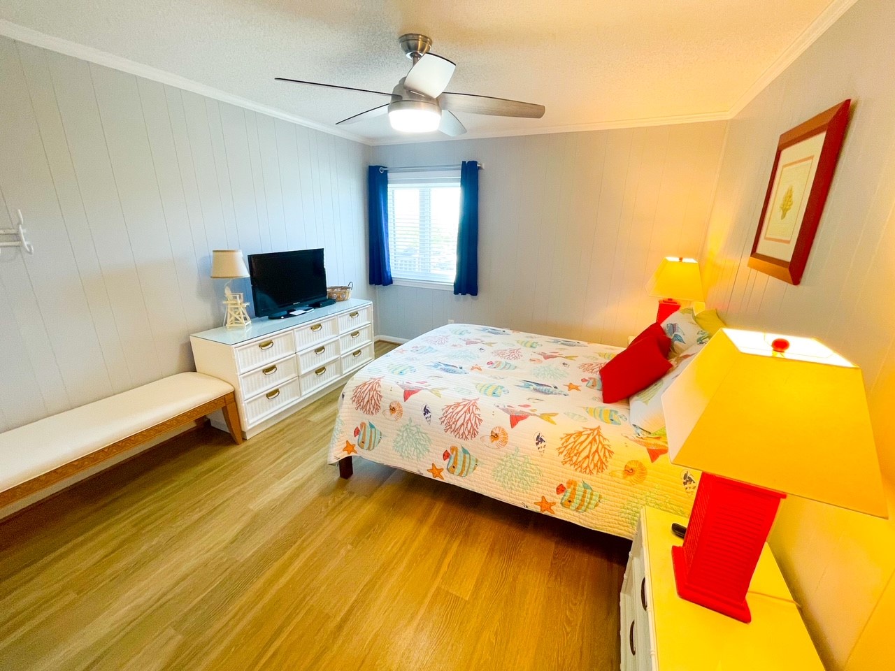 Your kids will love this cheerful bedroom with colorful furniture, fun bedding, and entertainment ready for family memories.
