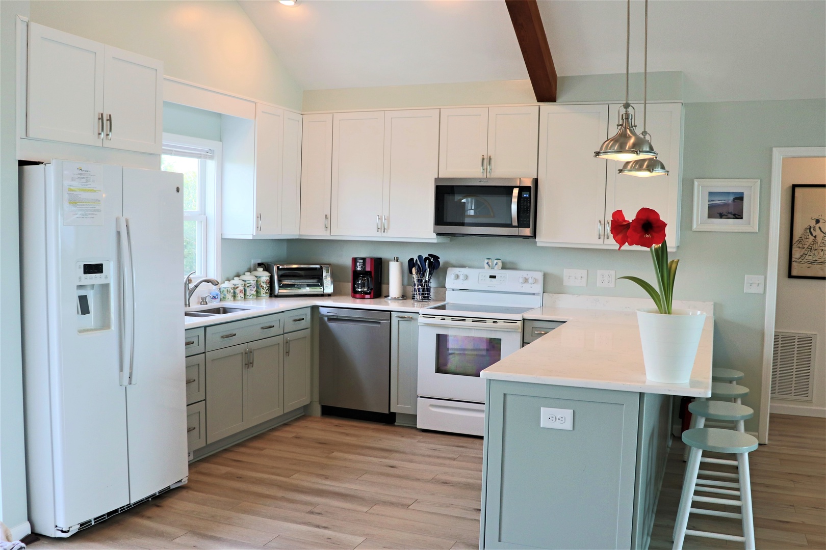 Cook memorable meals in your fully-equipped kitchen featuring modern appliances, granite countertops, and a breakfast bar perfect for morning coffee.