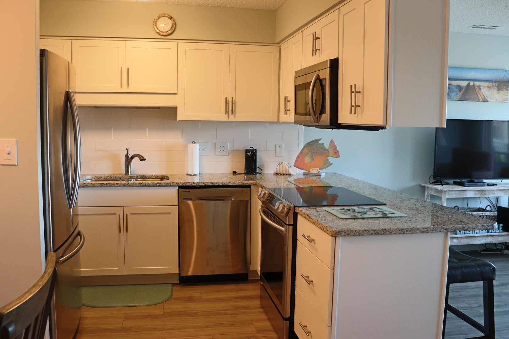 Your fully-equipped kitchen awaits with granite countertops, stainless steel appliances, and everything needed to prepare memorable meals during your stay.