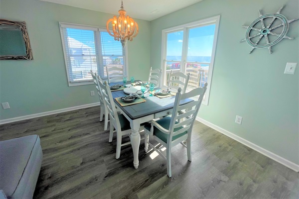 Gather around your coastal-themed dining table where nautical touches and soft sea-glass walls create the perfect setting for memorable meals together.