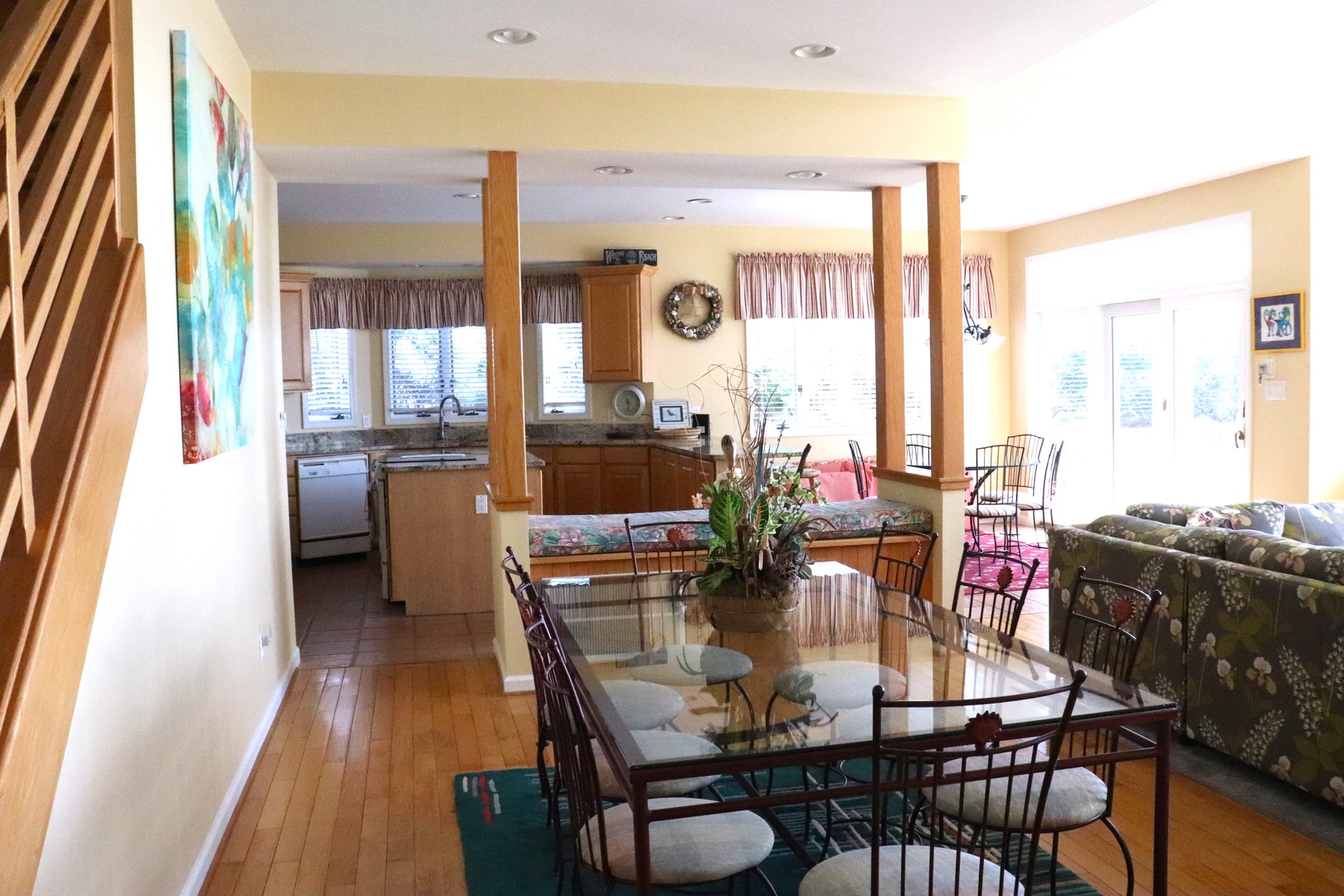 Your bright open-concept living space flows seamlessly from dining to kitchen, perfect for gathering with loved ones over meals and conversation.