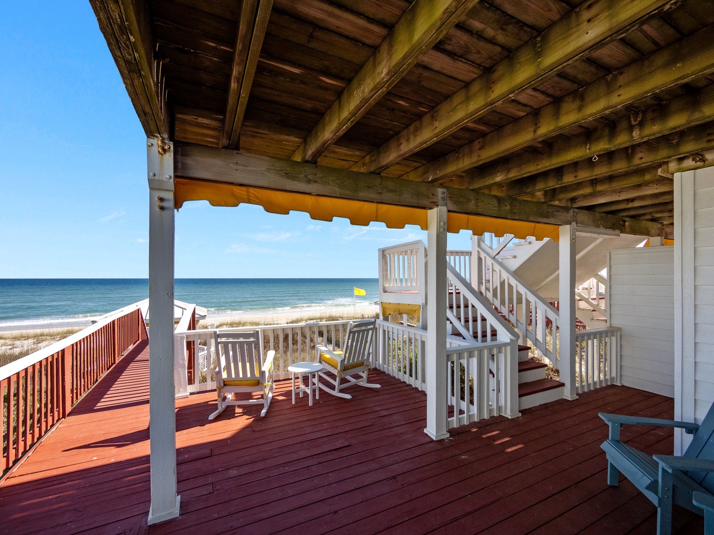 Relax on your private oceanfront deck with stunning sea views, comfortable seating, and direct beach access just steps away.