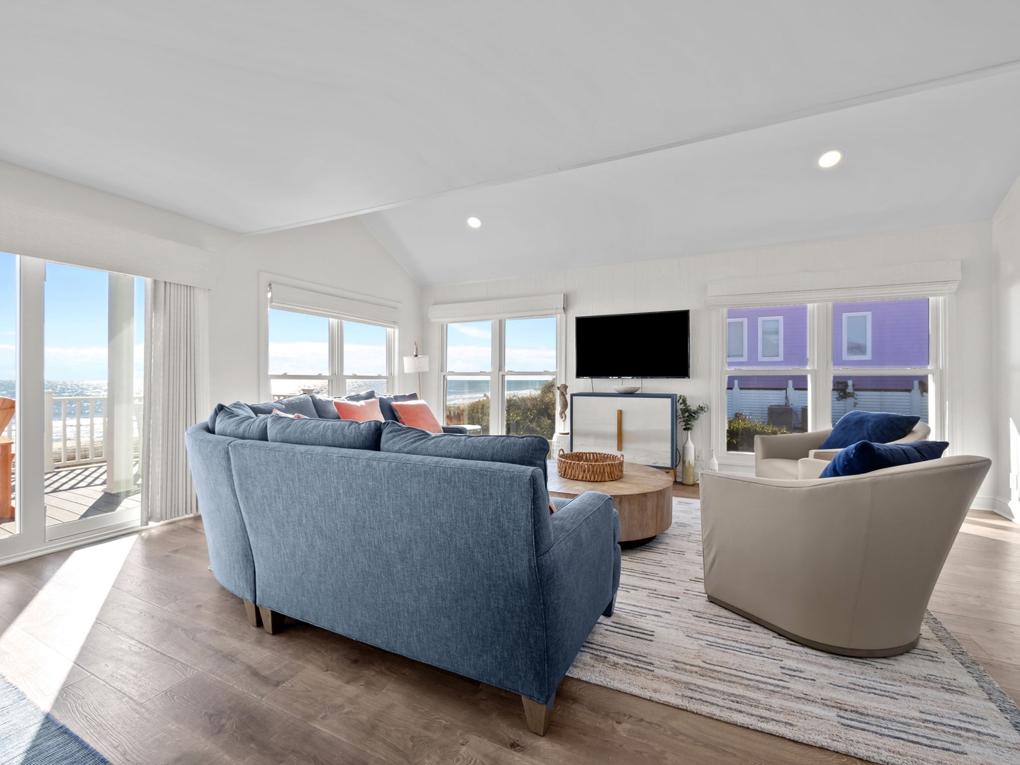 Unwind in your bright coastal retreat with panoramic water views, cozy seating, and modern amenities for the perfect seaside getaway.