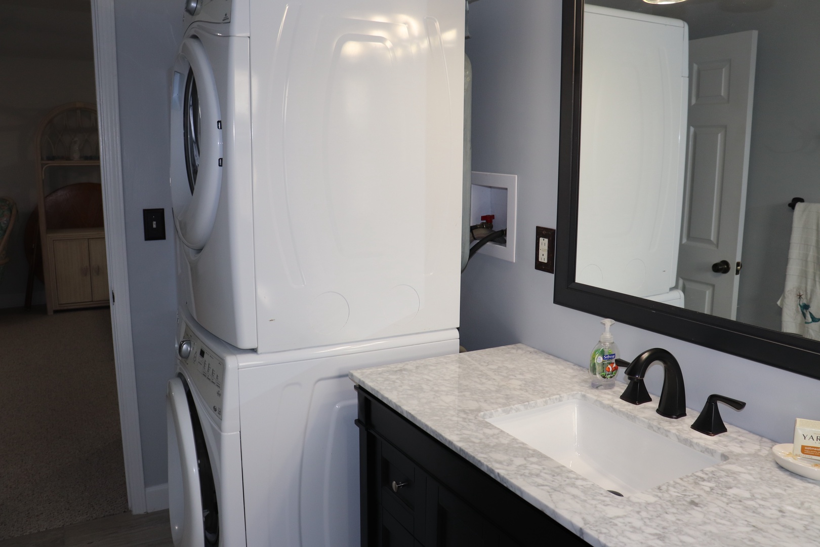 Your private bathroom features marble countertops and convenient in-unit laundry facilities, making longer stays effortless.