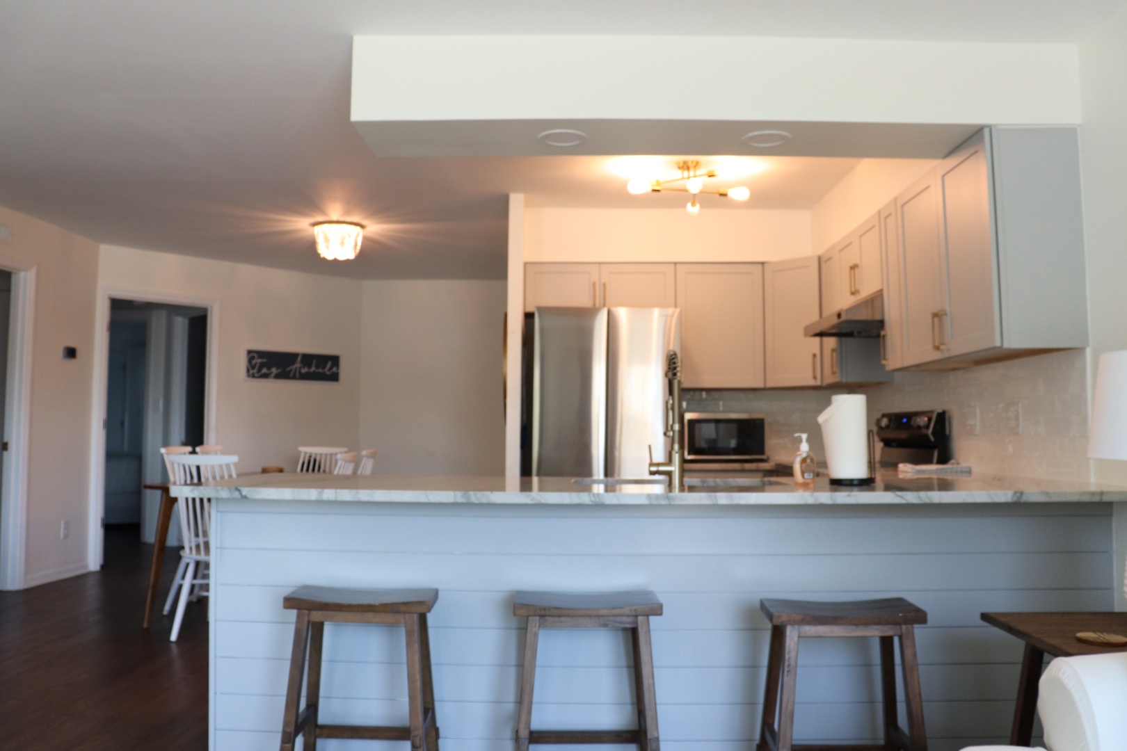 Your fully equipped kitchen features stainless steel appliances and a breakfast bar where you can enjoy morning coffee together.