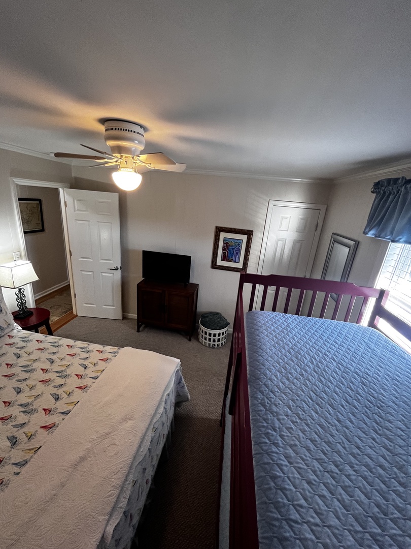 Your cozy bedroom awaits with soft linens, warm lighting, and thoughtful touches that make you feel right at home.