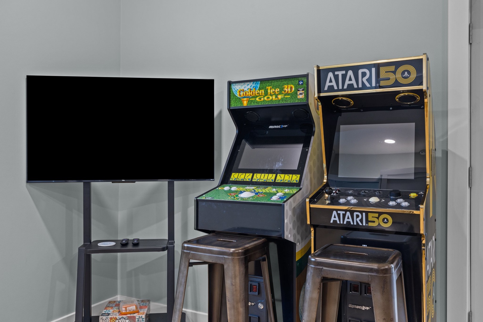 Challenge friends to classic arcade fun with vintage games and a large TV for epic gaming sessions.