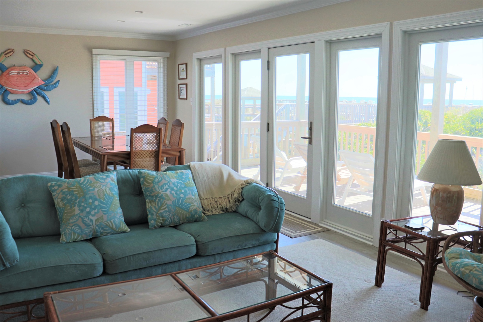 Unwind in your coastal living space where turquoise accents meet ocean breezes through French doors leading to your private balcony.