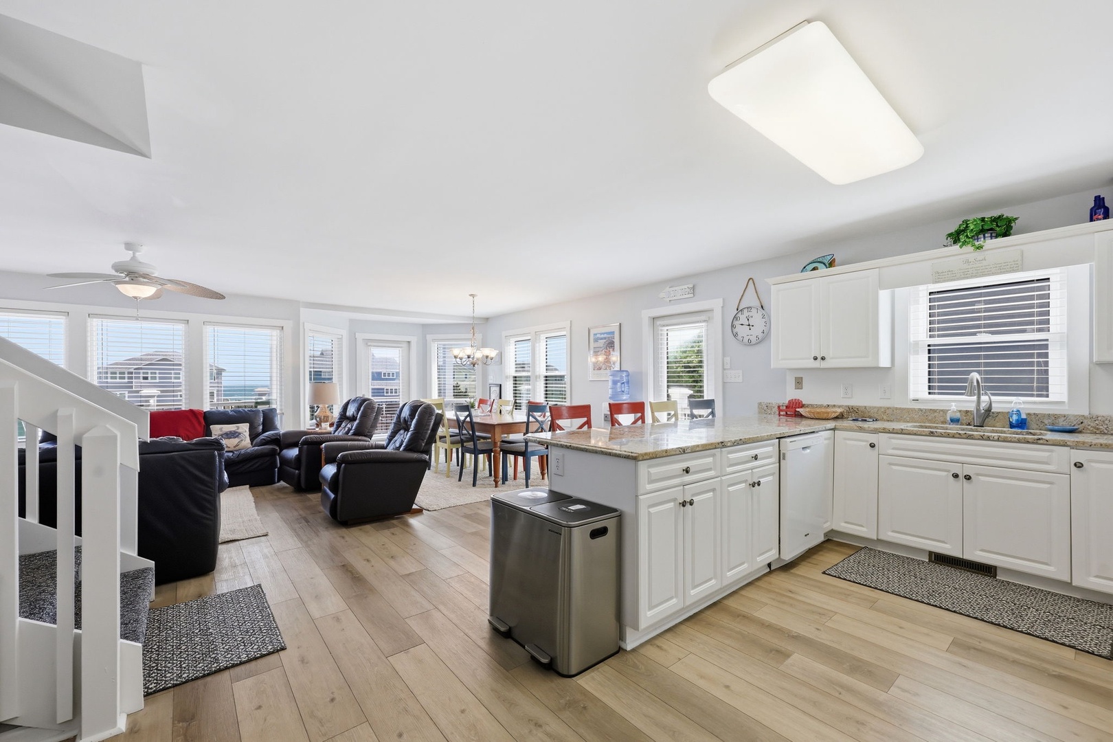 Sunlight floods through every window of your open-concept living space, where the kitchen, dining, and lounge areas blend effortlessly for easy togetherness and unforgettable family meals.