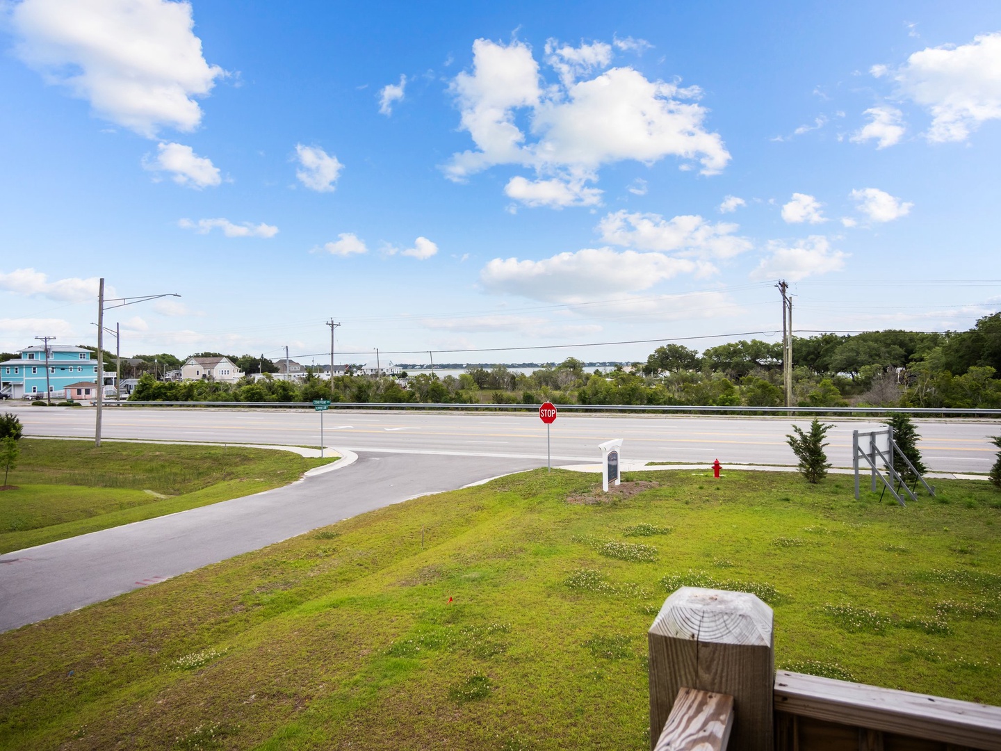 Property overlooks quiet residential streets with coastal homes dotting the peaceful neighborhood landscape.