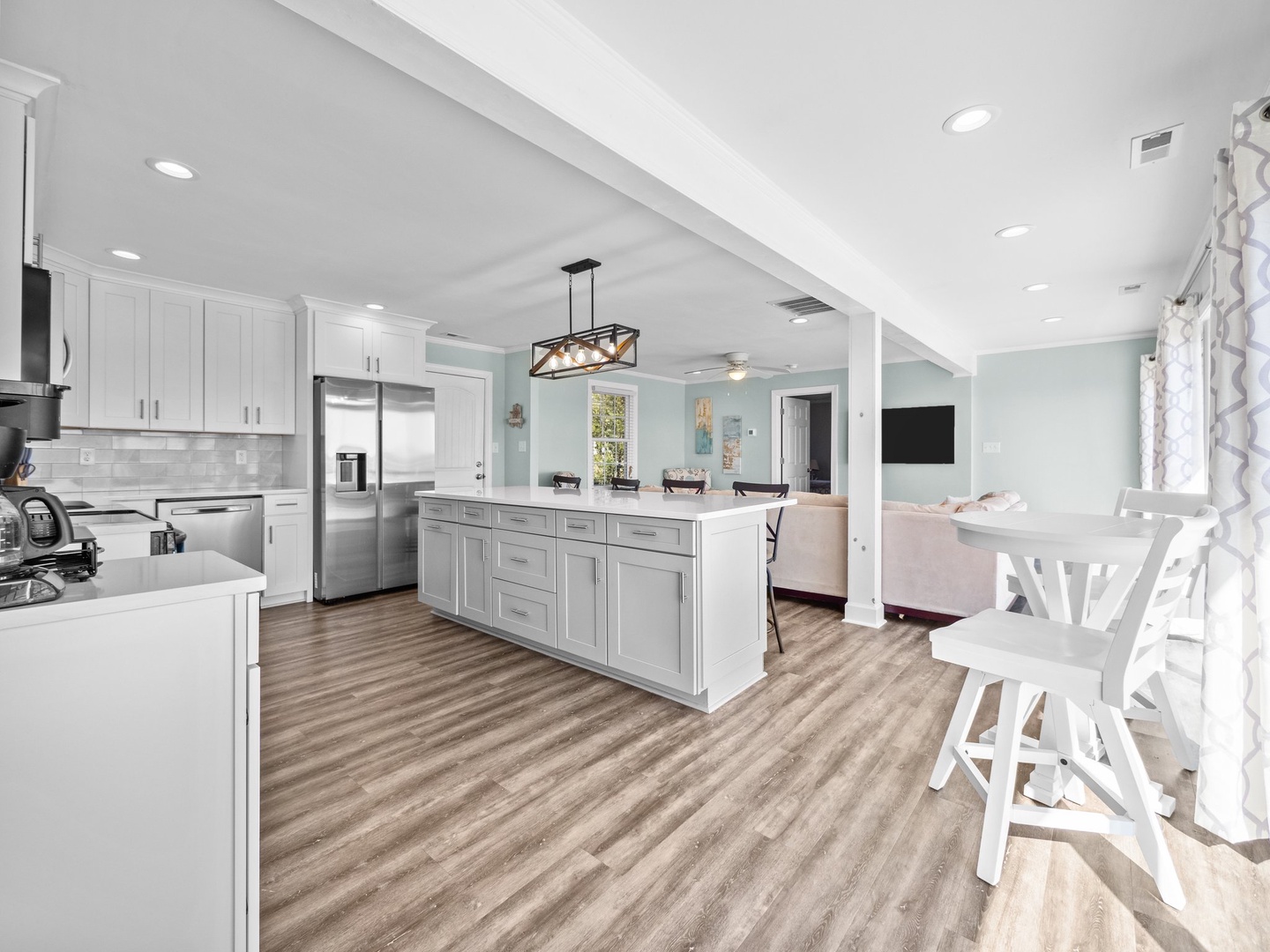 Your spacious open-concept kitchen flows seamlessly into the living area, perfect for gathering with family while you cook and entertain.