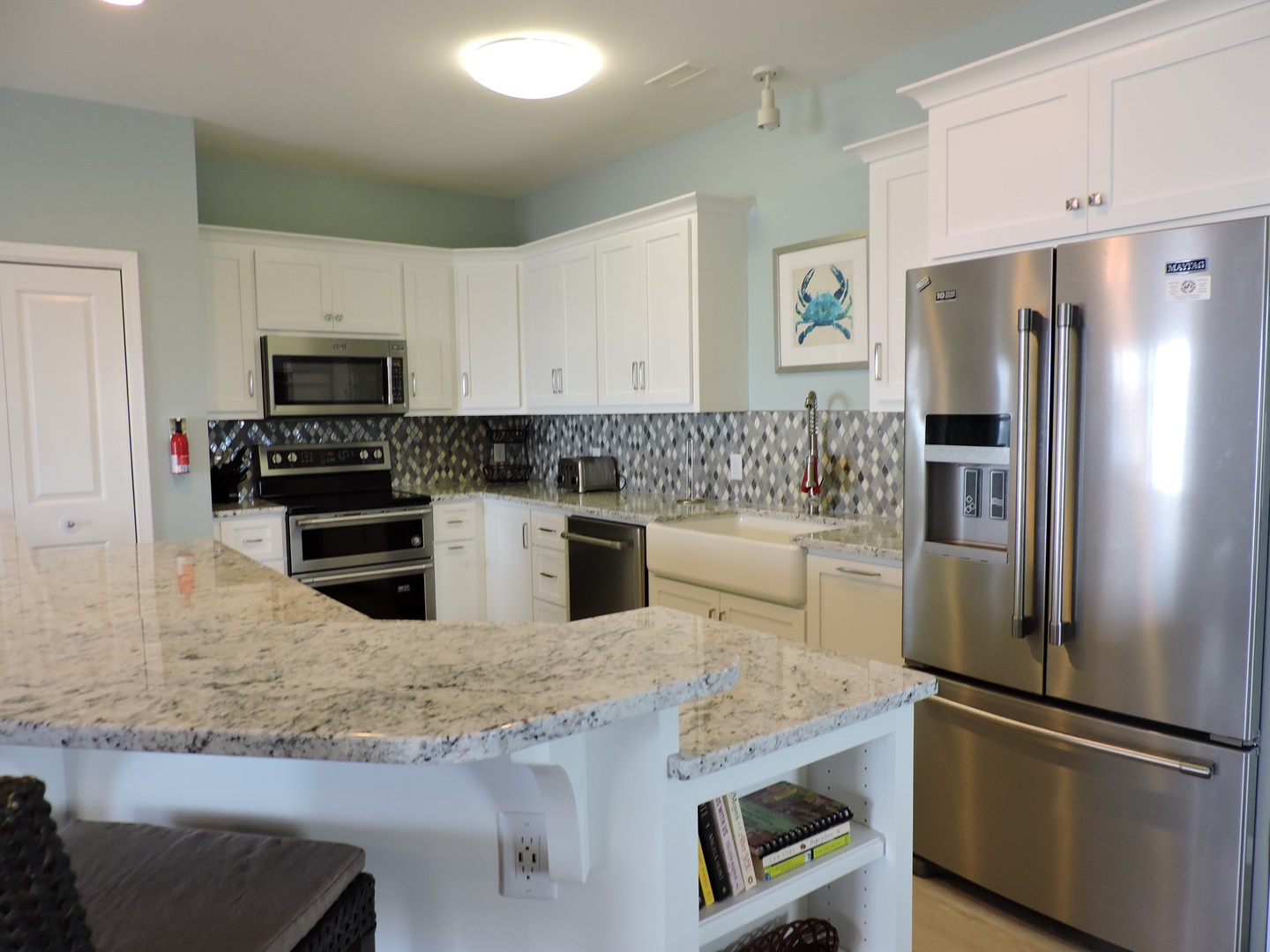 Your gourmet kitchen features granite countertops, stainless steel appliances, and a stylish tile backsplash for memorable meal preparation.