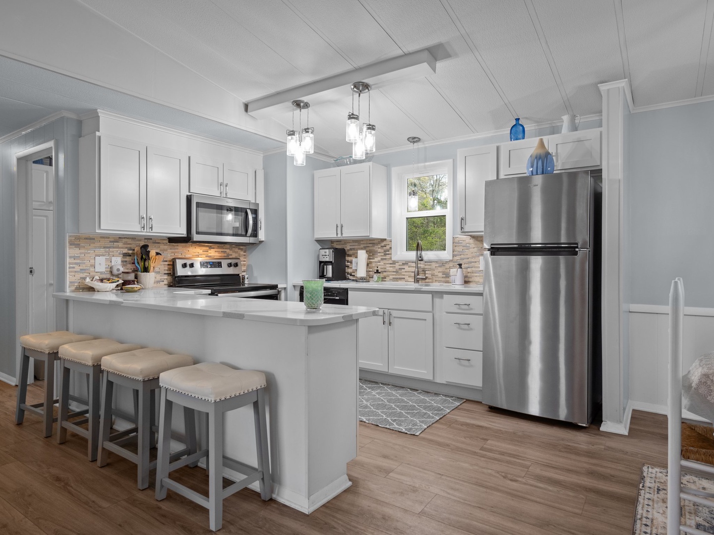 Your fully equipped kitchen invites culinary adventures with granite countertops, stainless steel appliances, and a breakfast bar perfect for morning coffee.