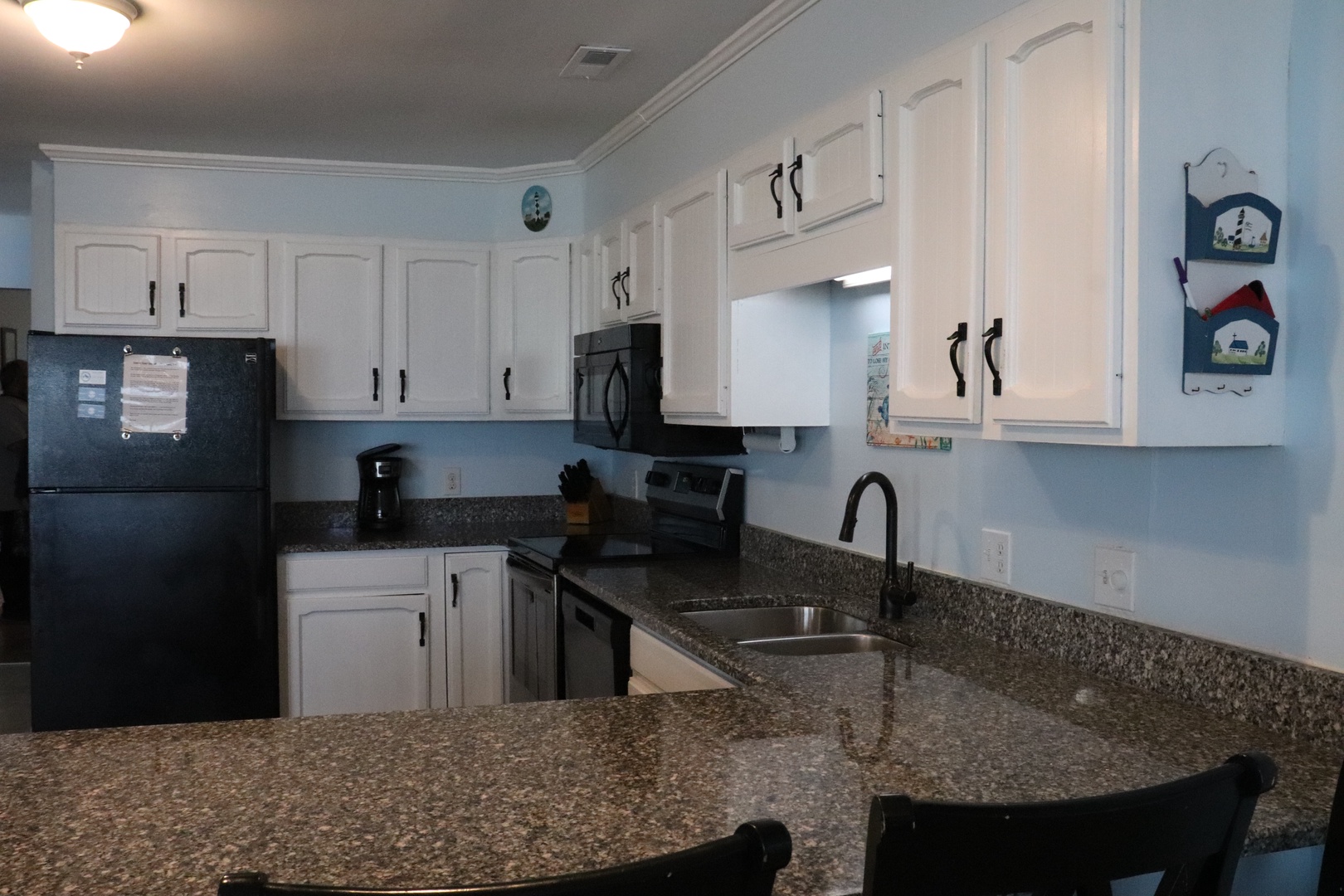 Your fully-equipped kitchen features granite countertops, modern appliances, and all the essentials to whip up meals just like home.