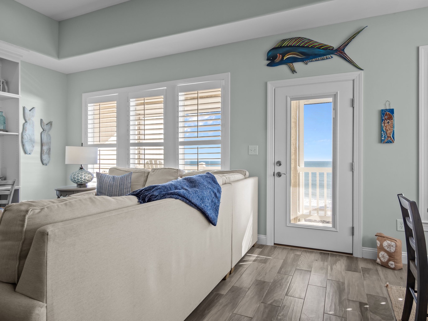 Relax in your coastal living room where ocean breezes flow through French doors to your private balcony.