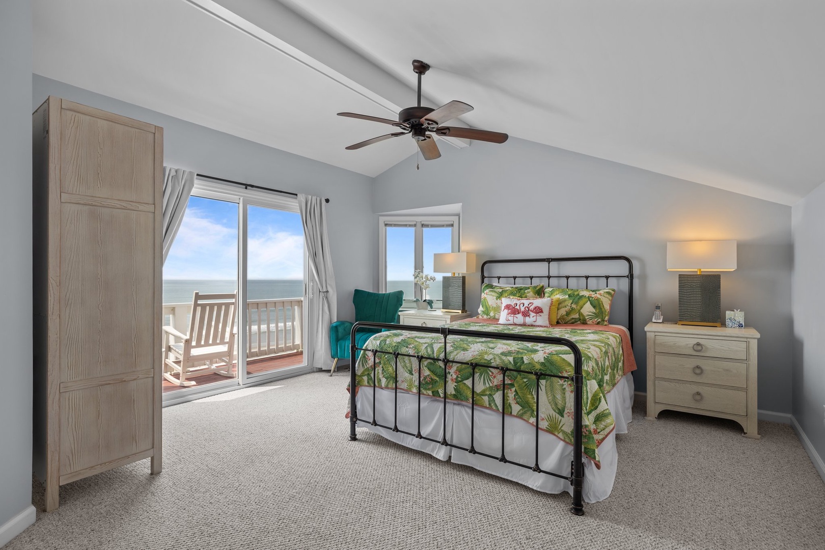 Wake up to breathtaking ocean views from your cozy bedroom, where tropical bedding and gentle sea breezes create your perfect coastal retreat.