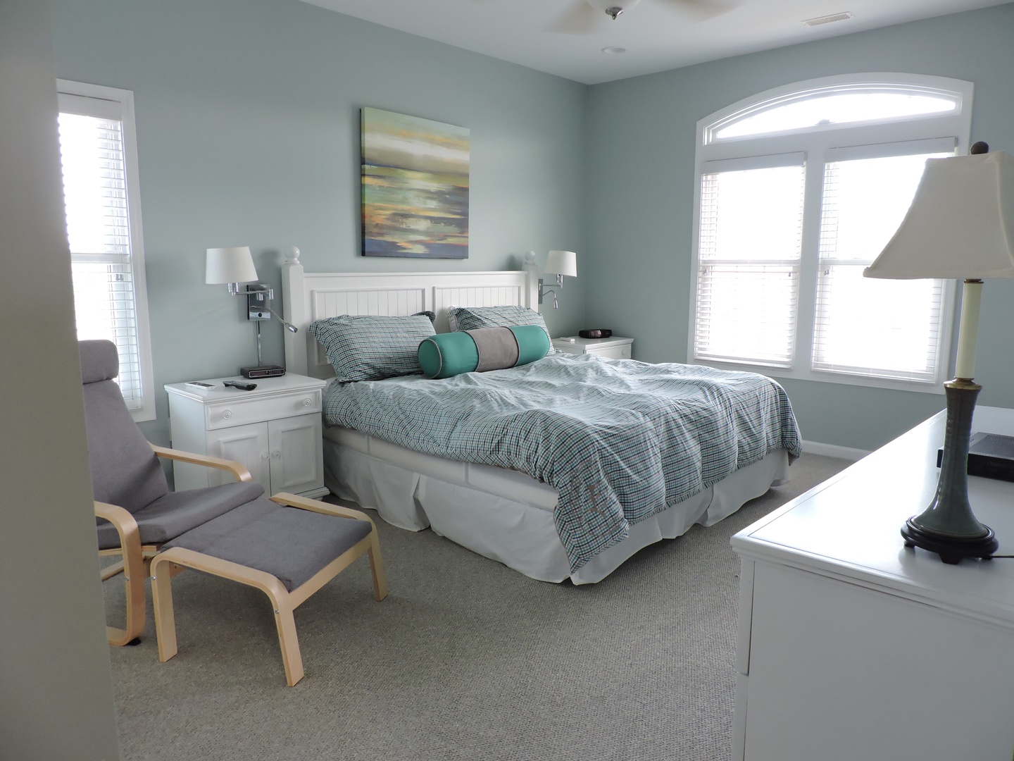 Sink into peaceful sleep in your calming bedroom sanctuary, where soft coastal colors and natural light create the perfect retreat for restoration.