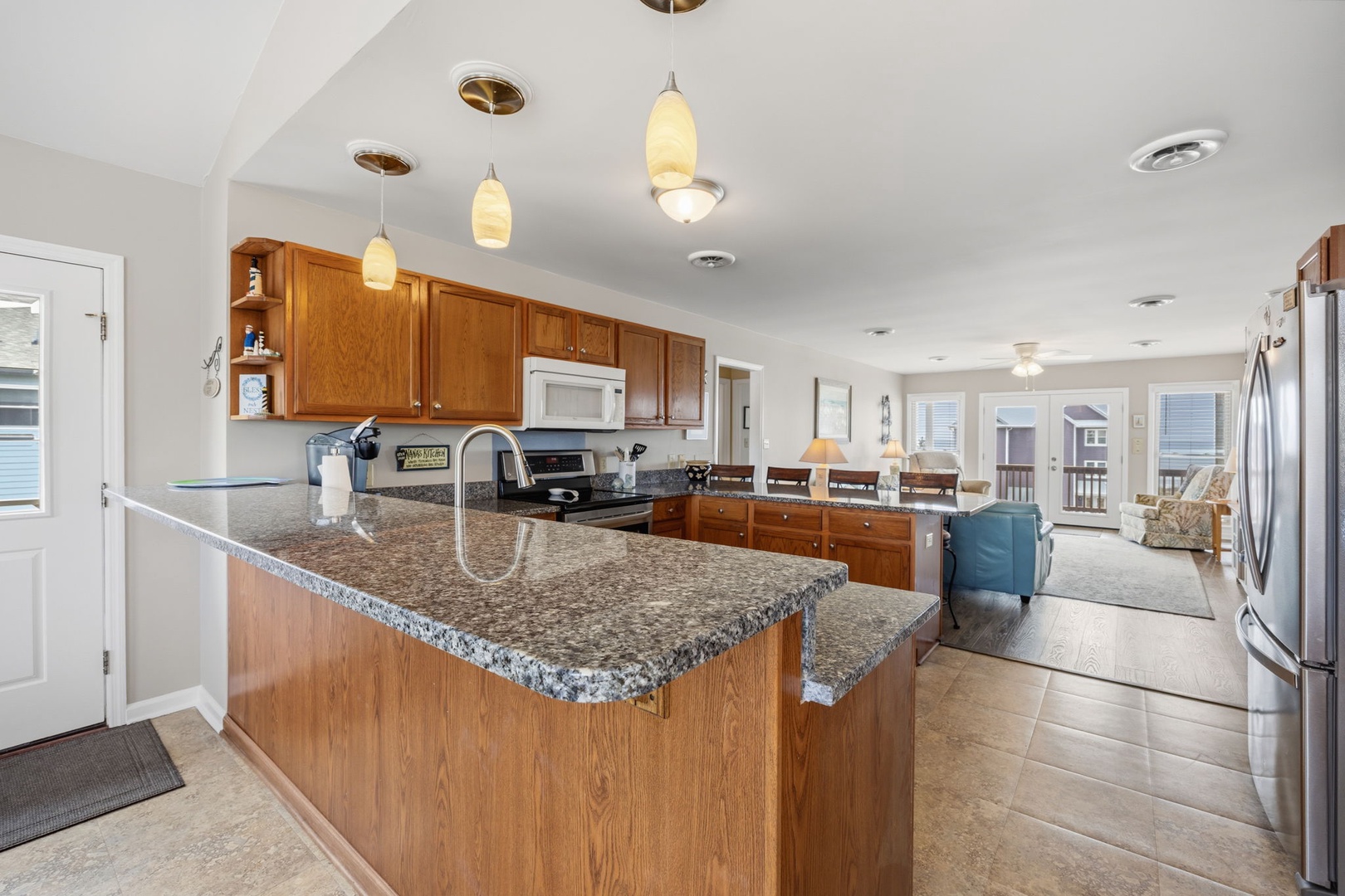 Your spacious kitchen features granite countertops and modern appliances, perfect for preparing meals during your stay.