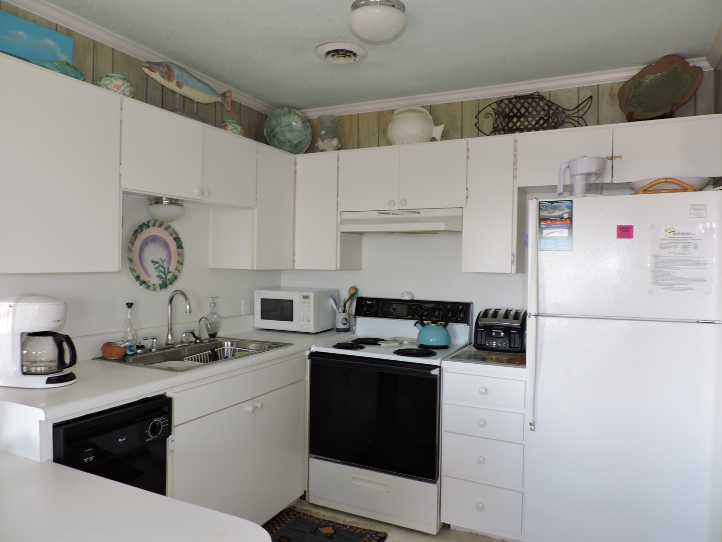 Your fully equipped kitchen awaits with everything needed for home-cooked meals, from morning coffee to family dinners together.